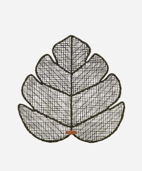 Hoja Palma placemat, handwoven iraca palm-leaf weave, styled on a table