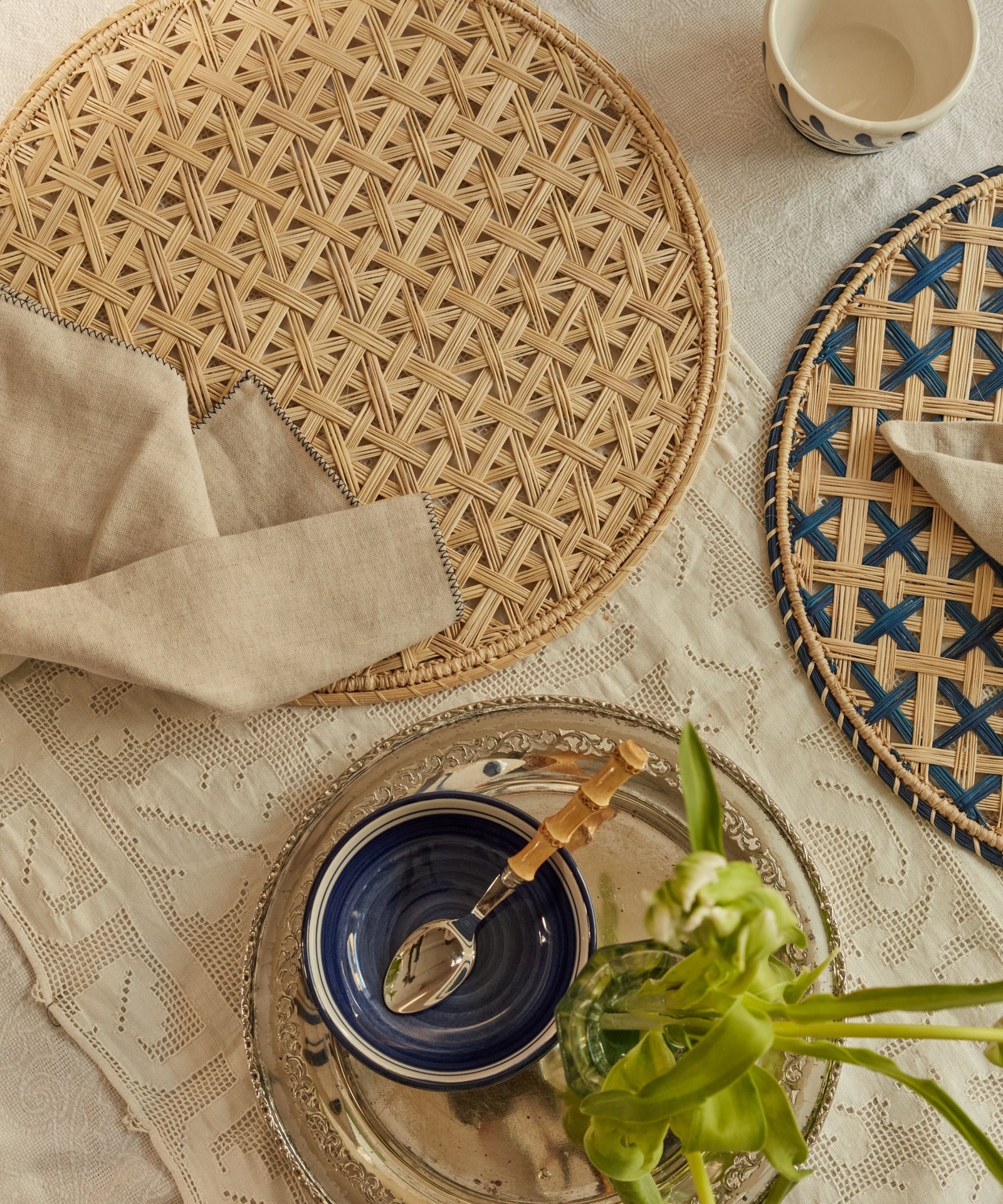 Cruces cross-weave placemat in natural, handwoven iraca palm, overhead view
