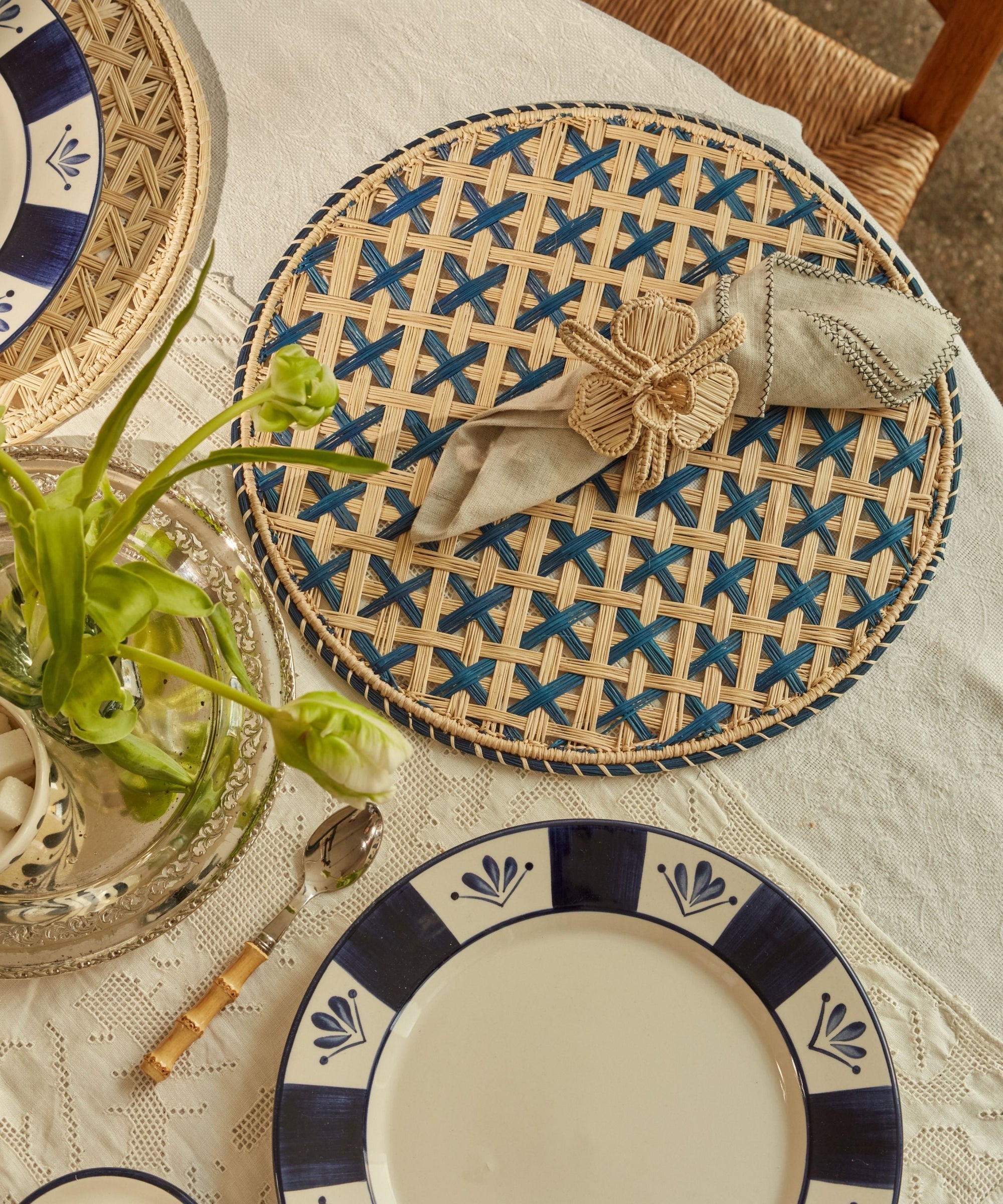 Cruces cross-weave placemat in deep blue, handwoven iraca palm, overhead view