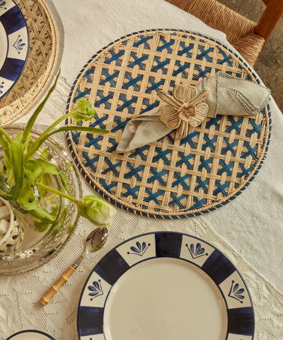 Cruces cross-weave placemat in deep blue, handwoven iraca palm, overhead view
