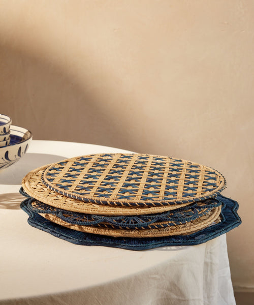 Cruces cross-weave placemat in deep blue, close-up of the iraca palm weave