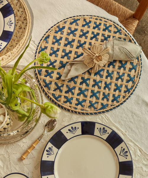 Cruces cross-weave placemat in deep blue, handwoven iraca palm, overhead view