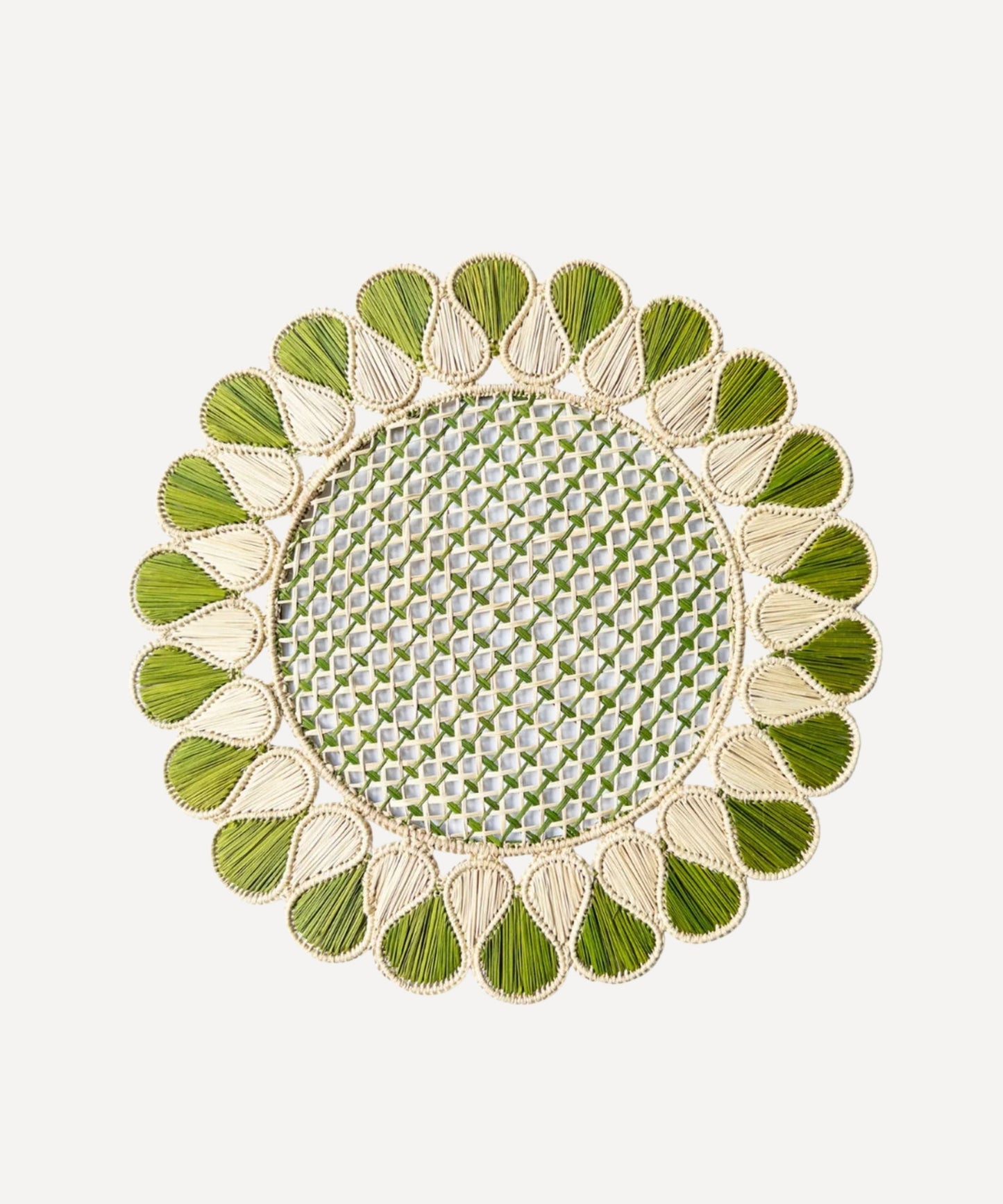 Lupita placemat in green, handwoven iraca palm, styled on a table