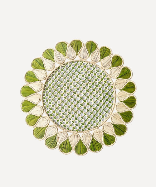 Lupita placemat in green, handwoven iraca palm, styled on a table