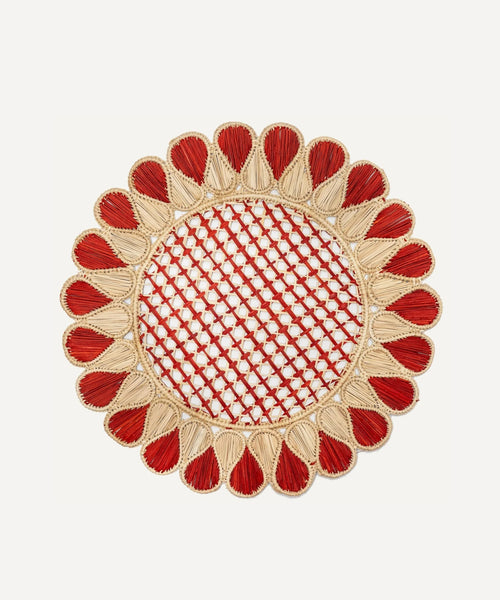 Lupita placemat in terracotta, handwoven iraca palm, styled on a table