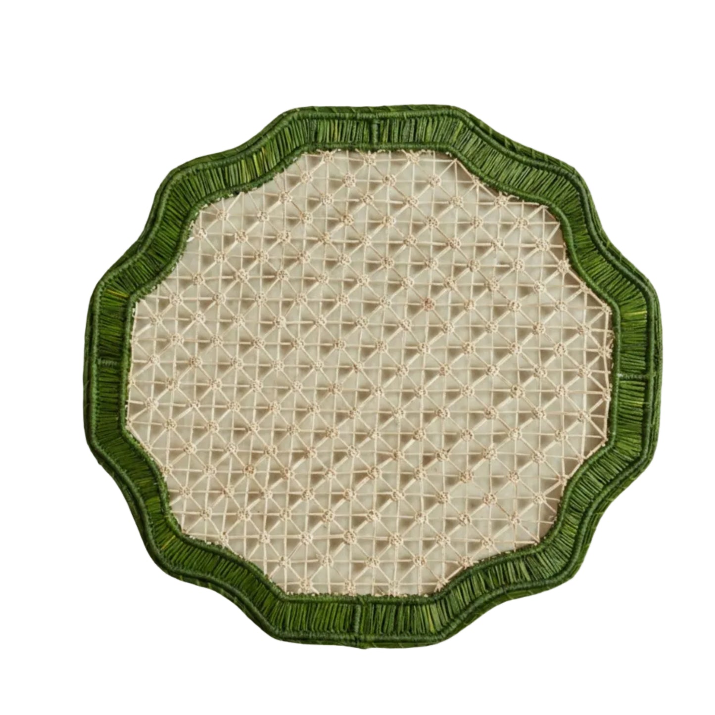 Deco geometric placemat in green, handwoven iraca palm, styled on a table