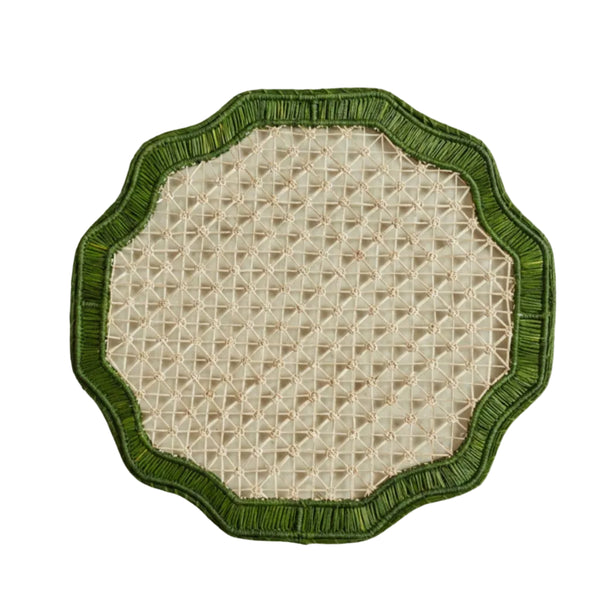 Deco geometric placemat in green, handwoven iraca palm, styled on a table