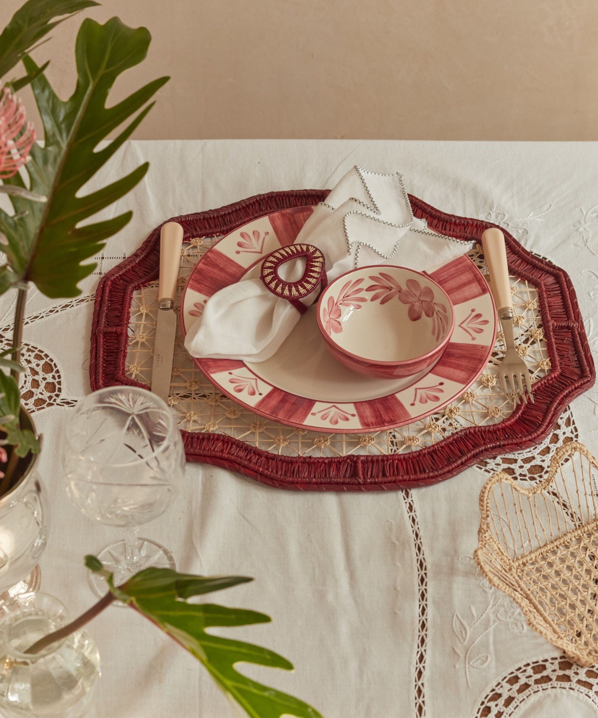 Deco geometric placemat in marsala, close-up of the iraca palm weave