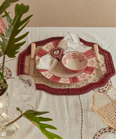 Deco geometric placemat in marsala, close-up of the iraca palm weave