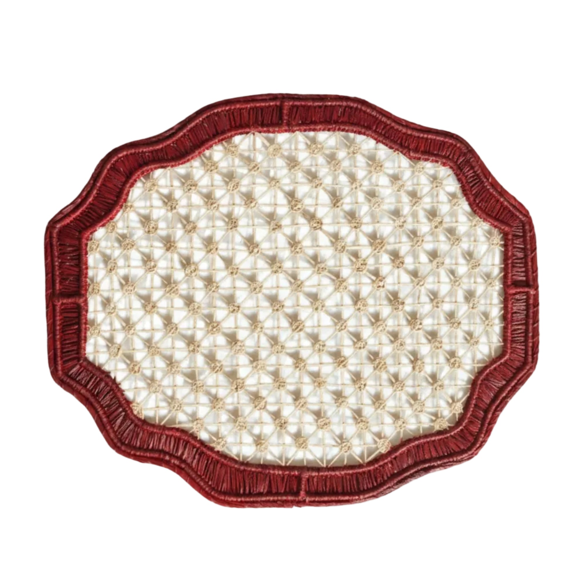Deco geometric placemat in marsala, handwoven iraca palm, styled on a table
