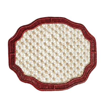 Deco geometric placemat in marsala, handwoven iraca palm, styled on a table