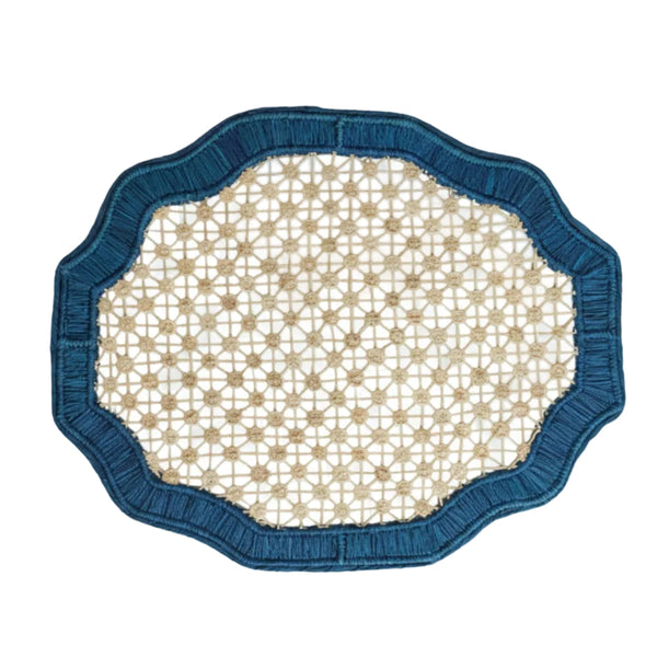 Deco geometric placemat in deep blue, handwoven iraca palm, styled on a table