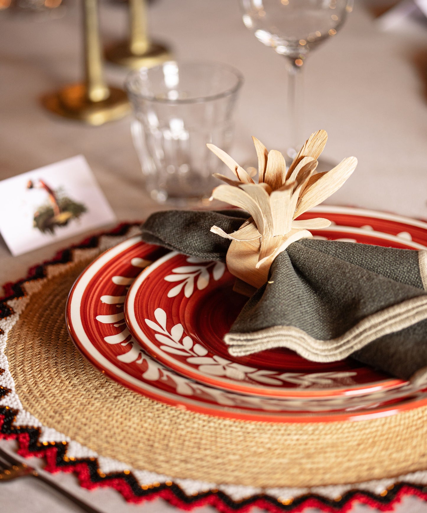 Dark Flor Side Plate in Rust Red — detail of the hand-painted white floral motif