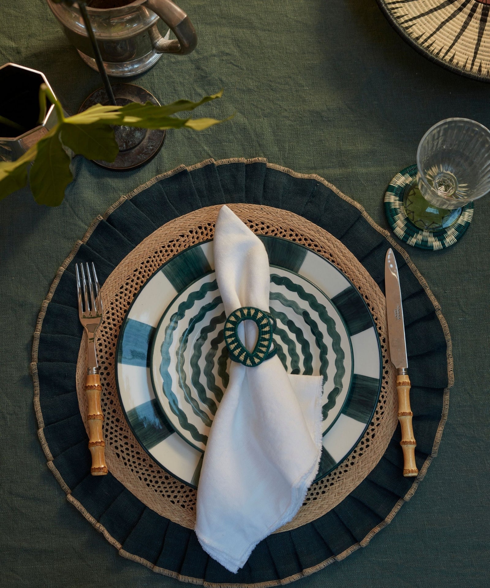 Gota Werregue napkin ring in teal, handwoven werregue palm, styled with tableware