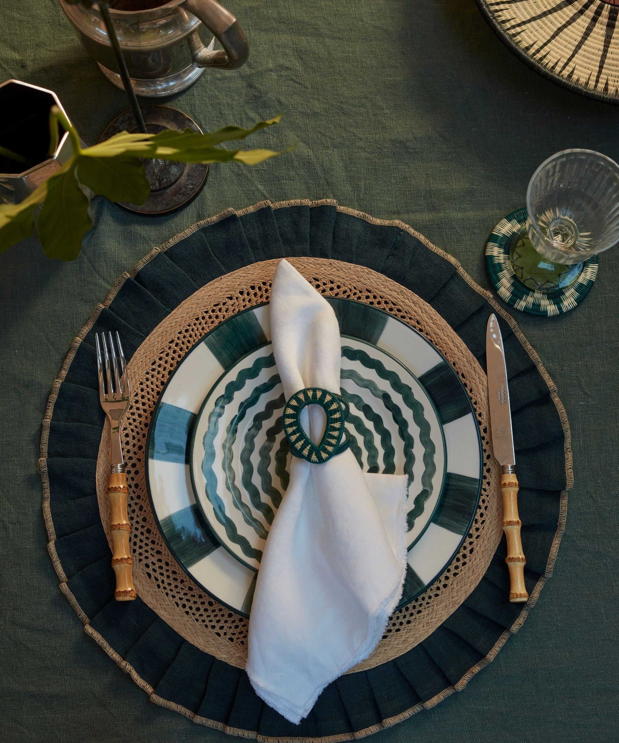 Gota Werregue napkin ring in teal, handwoven werregue palm, styled with tableware