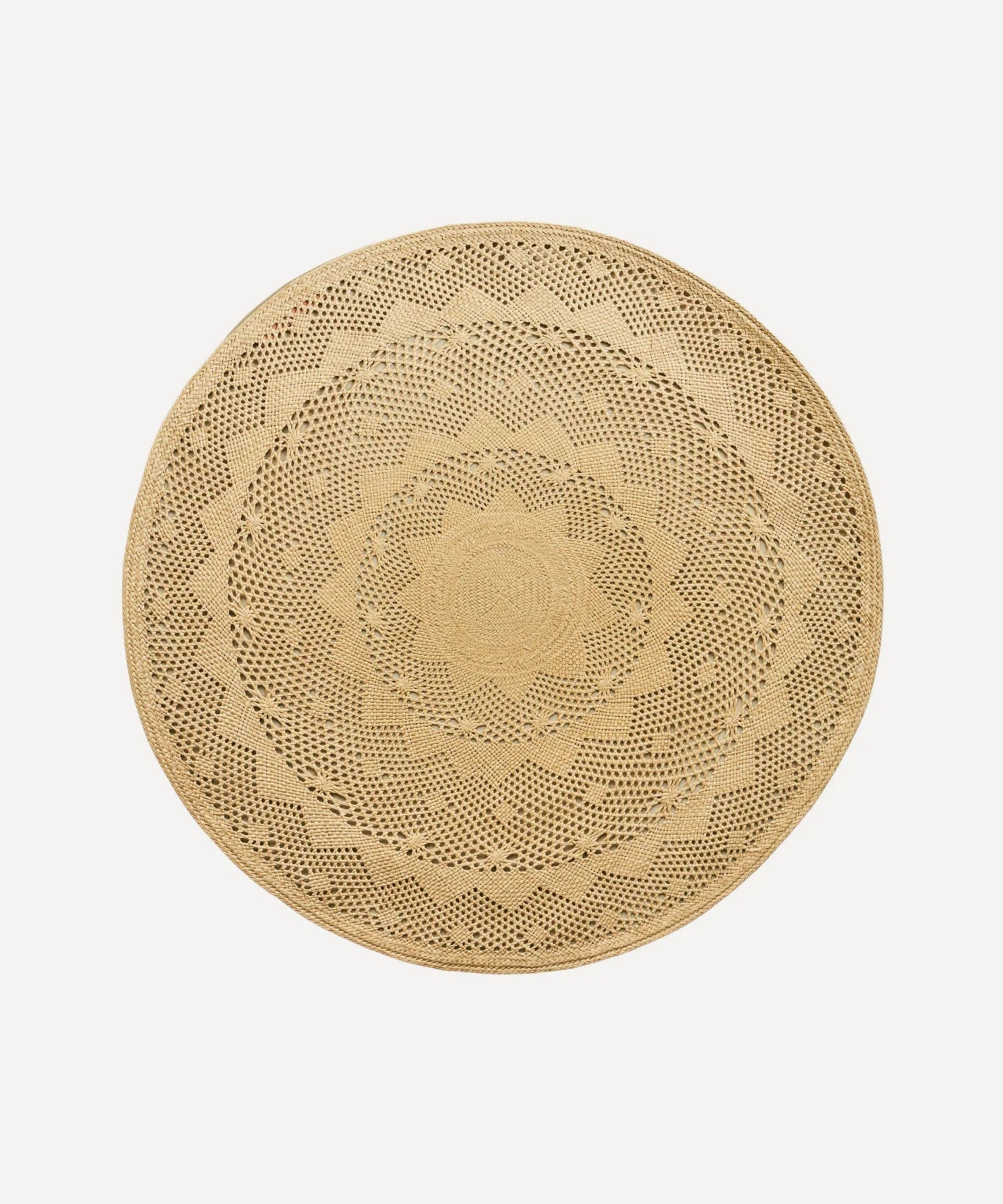 Palm Lace placemat, handwoven iraca palm, styled on a table