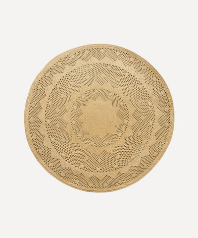 Palm Lace placemat, handwoven iraca palm, styled on a table