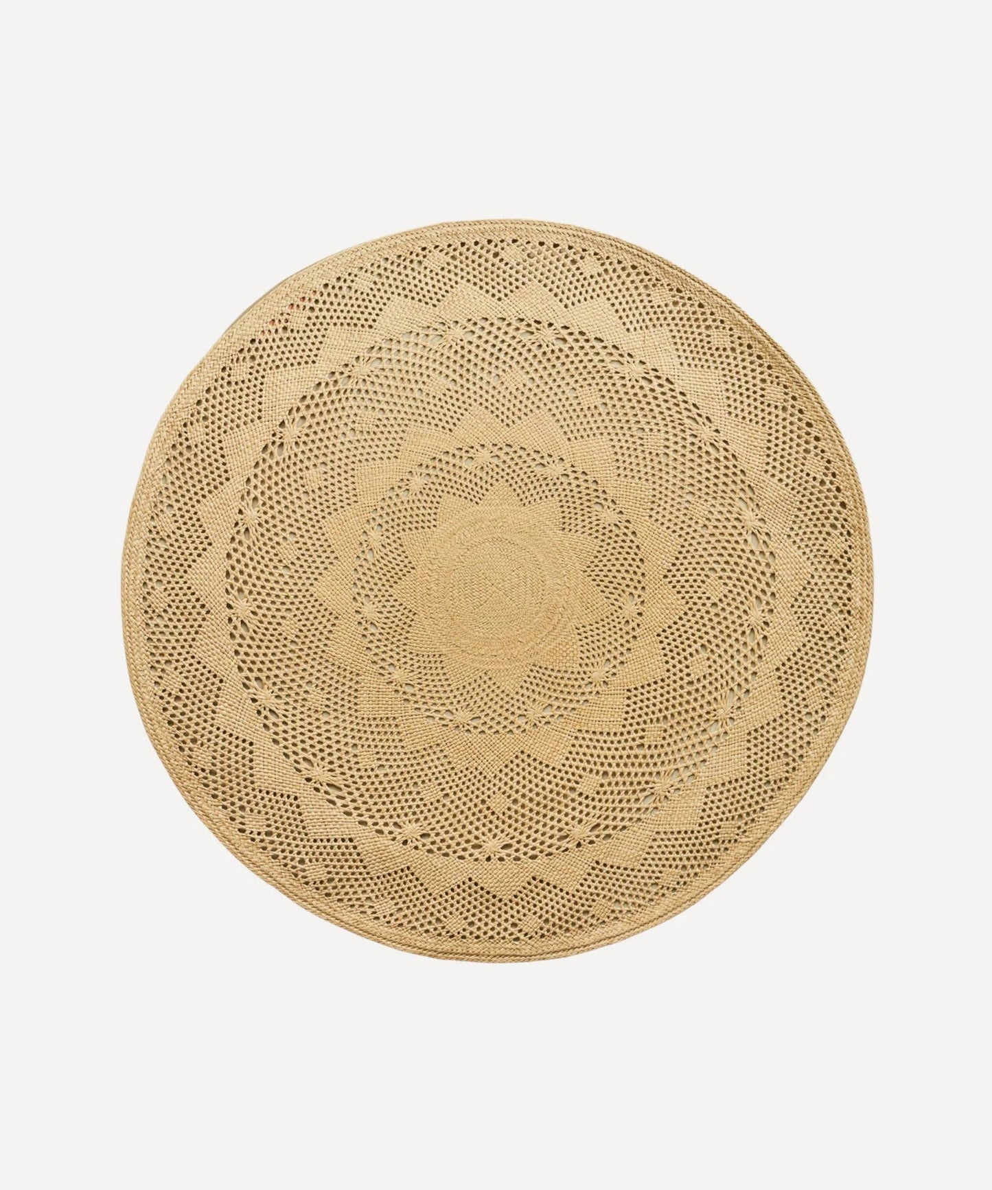 Palm Lace placemat, handwoven iraca palm, styled on a table