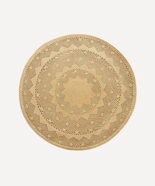 Palm Lace placemat, handwoven iraca palm, styled on a table