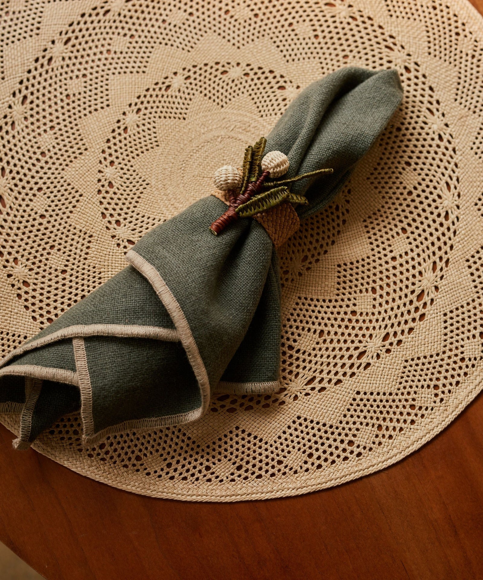 Palm Lace placemat, openwork iraca palm weave, overhead view