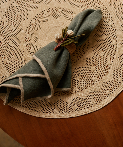 Mistletoe napkin ring, handwoven iraca palm, close-up detail