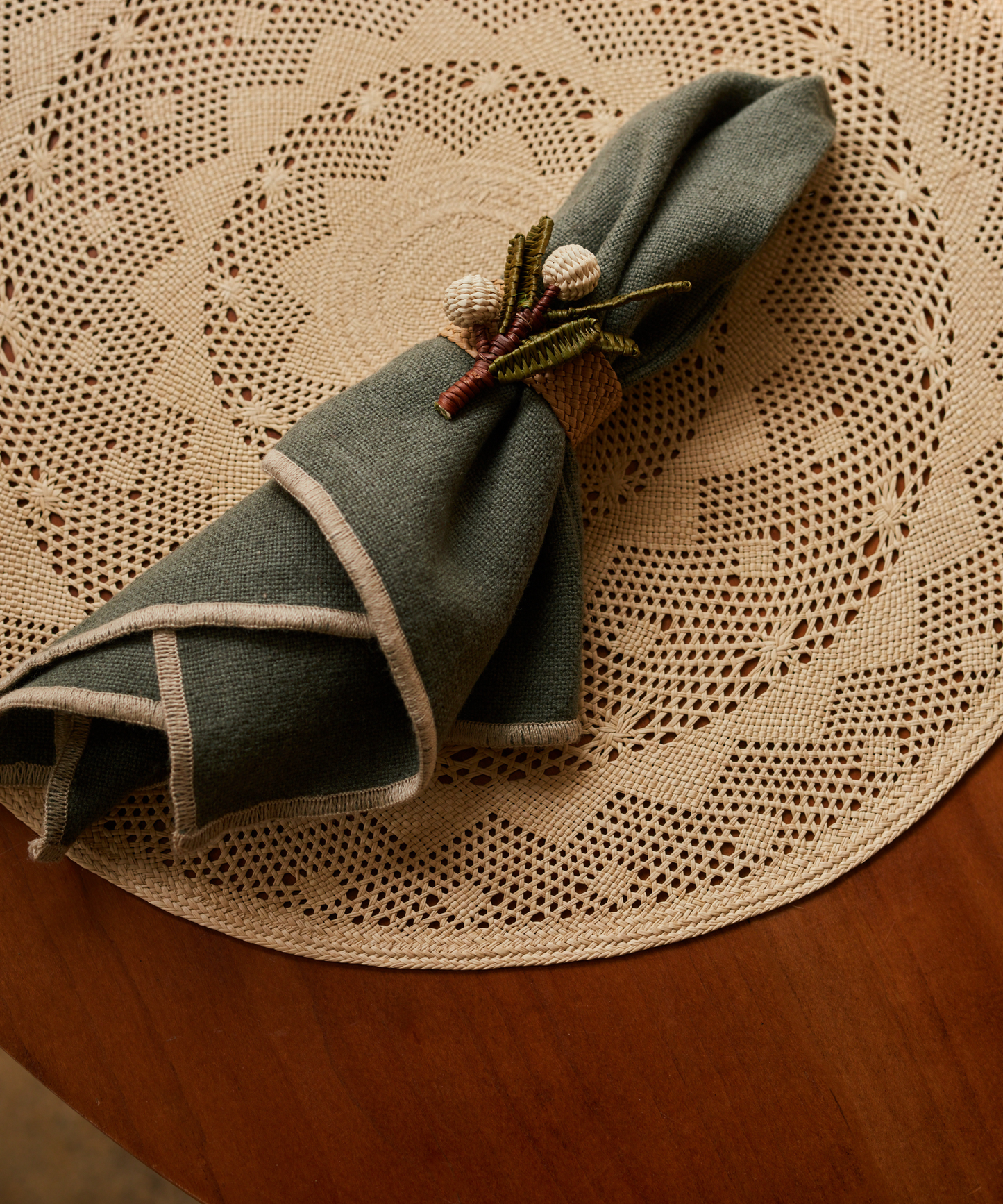 Mistletoe napkin ring, handwoven iraca palm, close-up detail