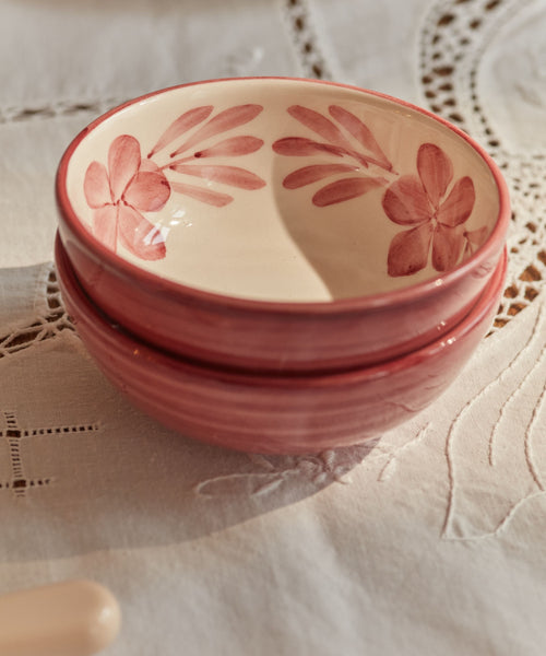 Hand-painted Flor Bowl in Vintage Rose, floral motif on a white ground.