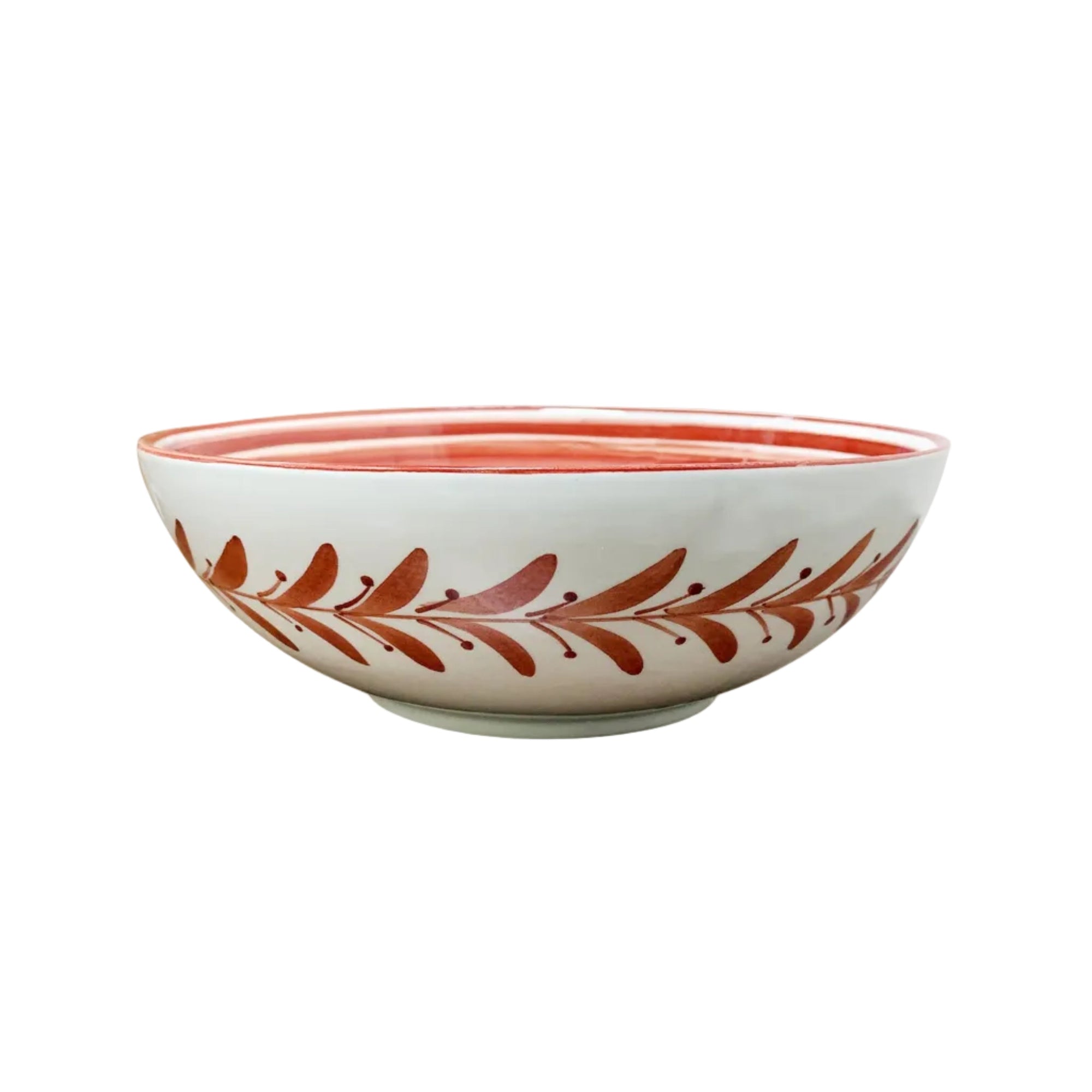 Helecho large salad bowl in Rust Red — a hand-painted fern wreath ceramic bowl from Carmen del Viboral, Colombia, shown front-on.