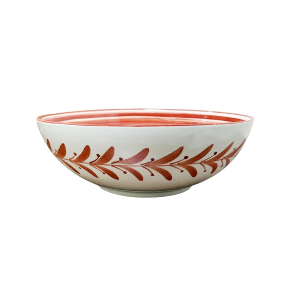 Helecho large salad bowl in Rust Red — a hand-painted fern wreath ceramic bowl from Carmen del Viboral, Colombia, shown front-on.