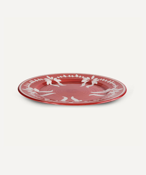Flor Dinner Plate in Rust Red, hand-painted floral ceramic — close-up of the glaze