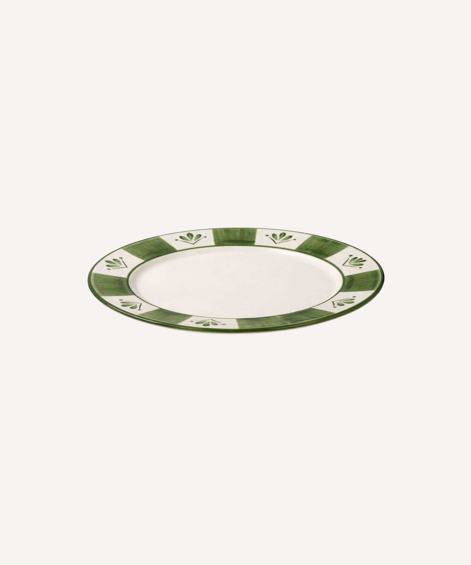 Flor de Lis Dinner Plate in Fern Green, floral ceramic — overhead view