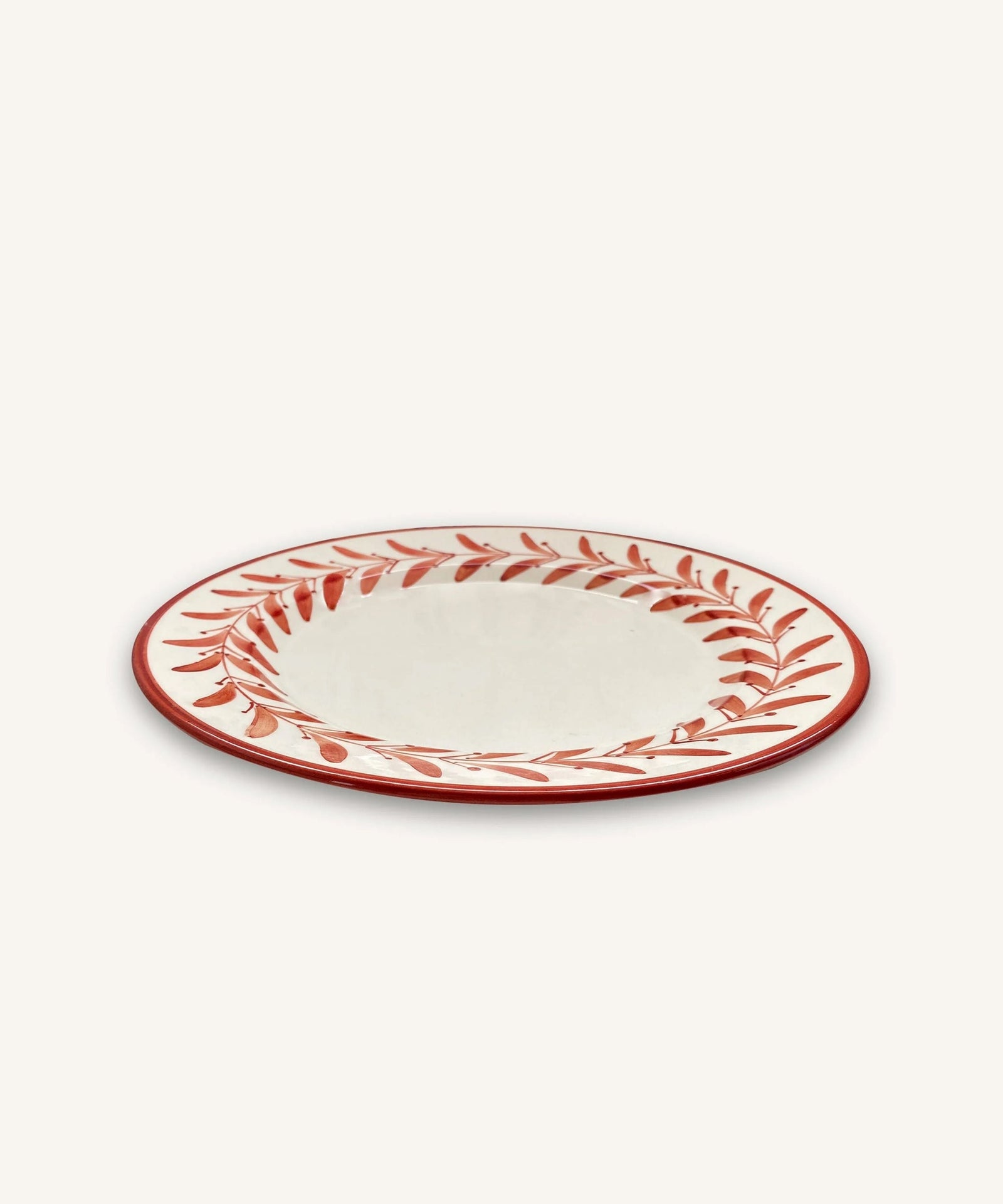 Helecho Dinner Plate Rust Red top-down view — hand-painted Colombian ceramic