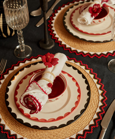 Cascos Side Plate in Rust Red, scalloped ceramic — on a table setting