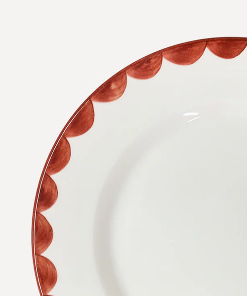 Cascos Side Plate in Rust Red, scalloped ceramic — side profile