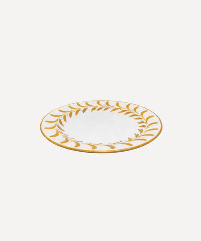 Helecho Side Plate Golden Yellow top-down view — fern wreath on white ground