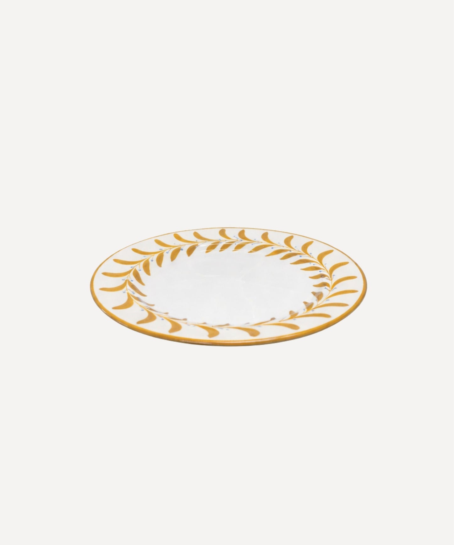 Helecho Side Plate Golden Yellow top-down view — fern wreath on white ground