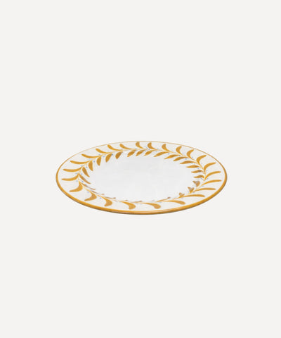 Helecho Side Plate Golden Yellow top-down view — fern wreath on white ground