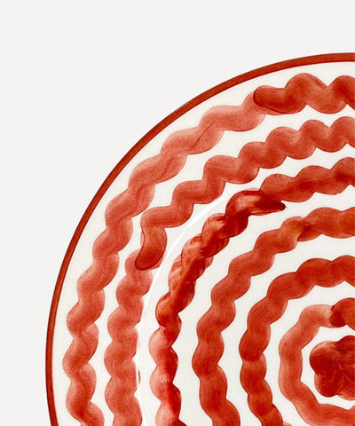 Ondas Side Plate in Rust Red, rippled ceramic — overhead view