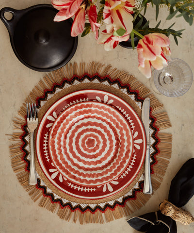 Ondas Side Plate in Rust Red, rippled ceramic — on a table setting