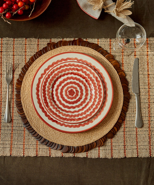 Ondas Side Plate in Rust Red — detail of the rippled circles