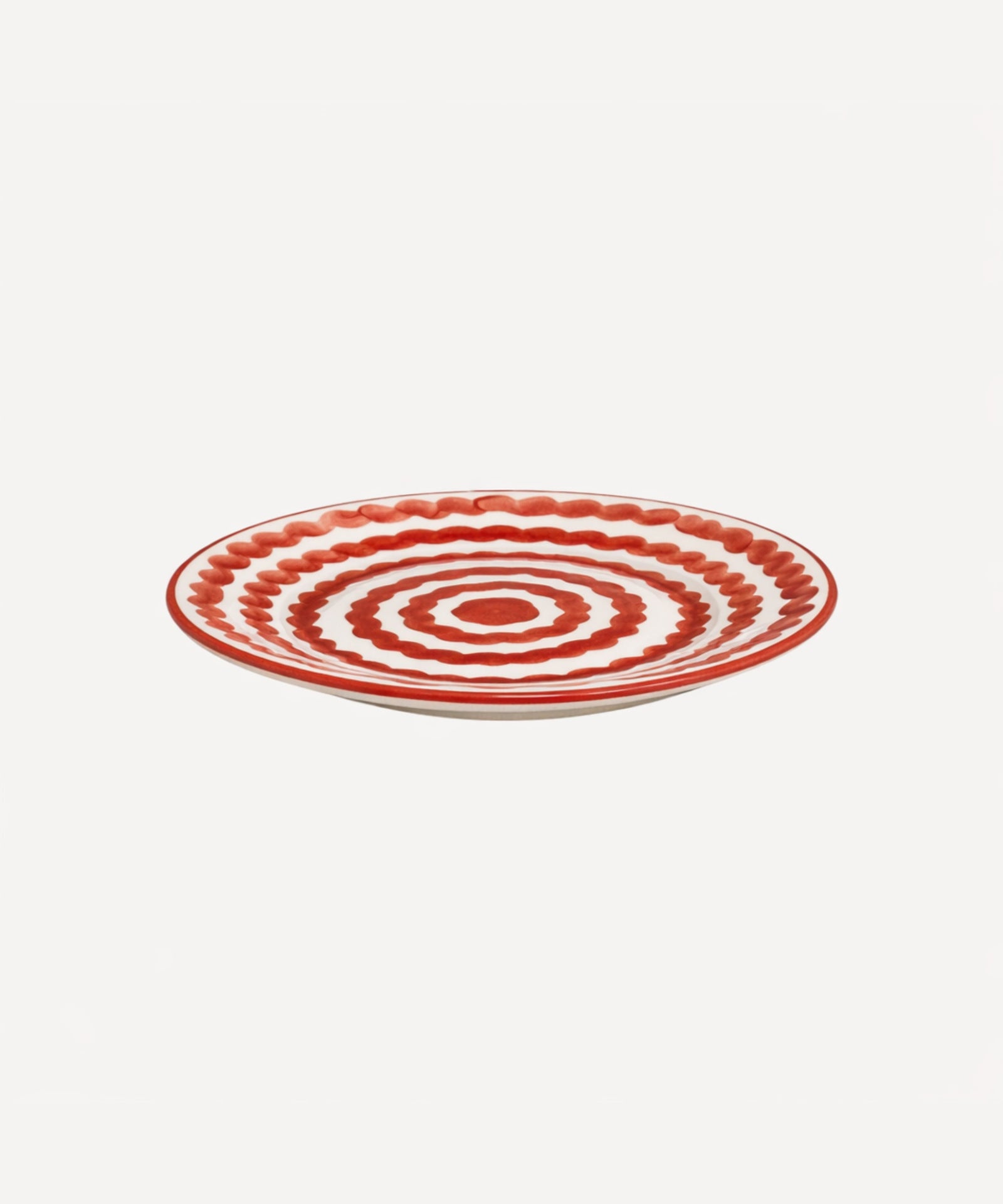 Ondas Side Plate in Rust Red, rippled ceramic — side profile