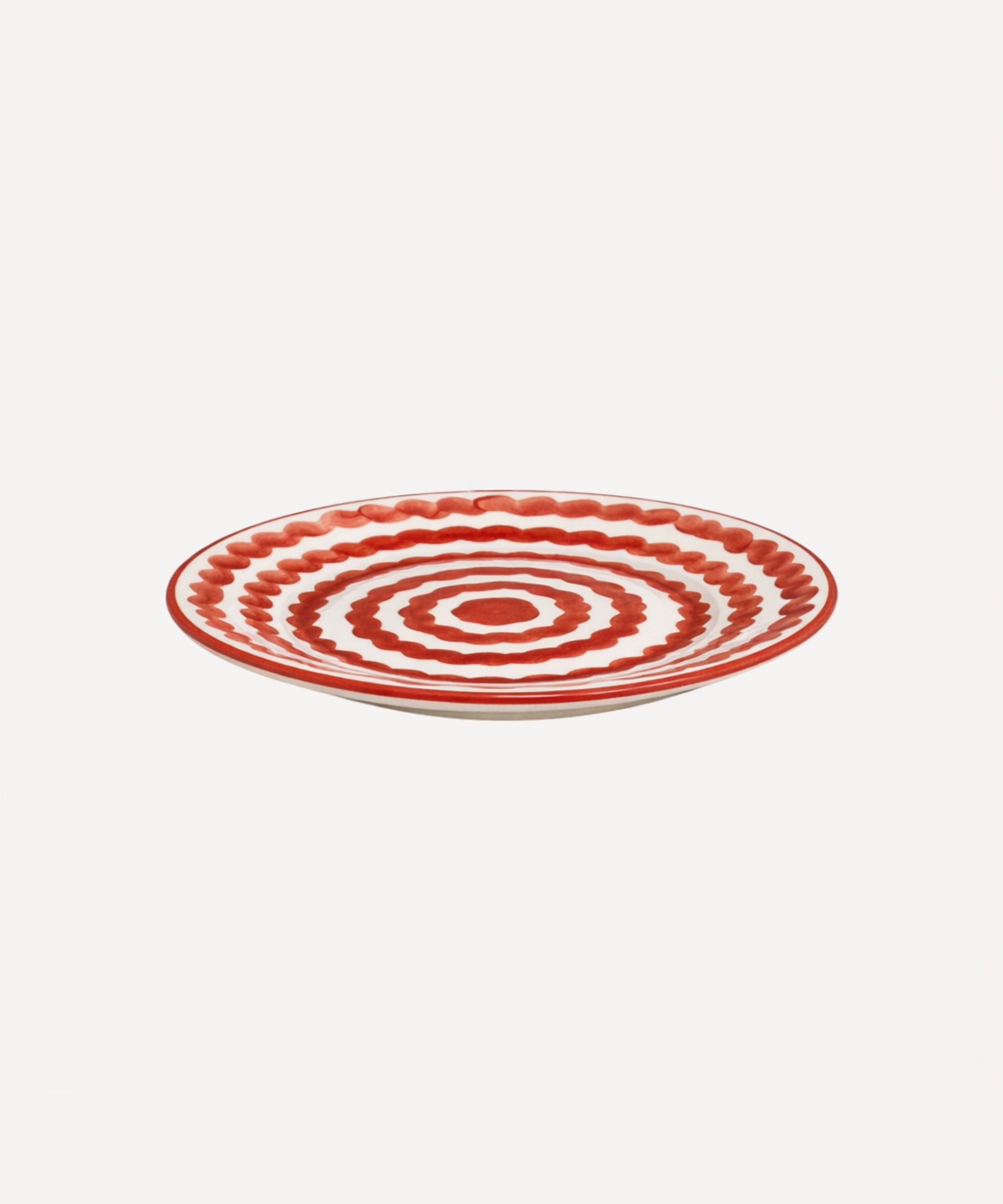 Ondas Side Plate in Rust Red, rippled ceramic — side profile