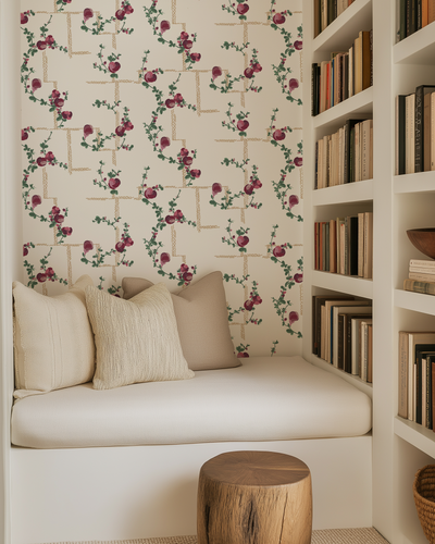 Cozy nook with floral wallpaper, cushioned bench, and bookshelf.