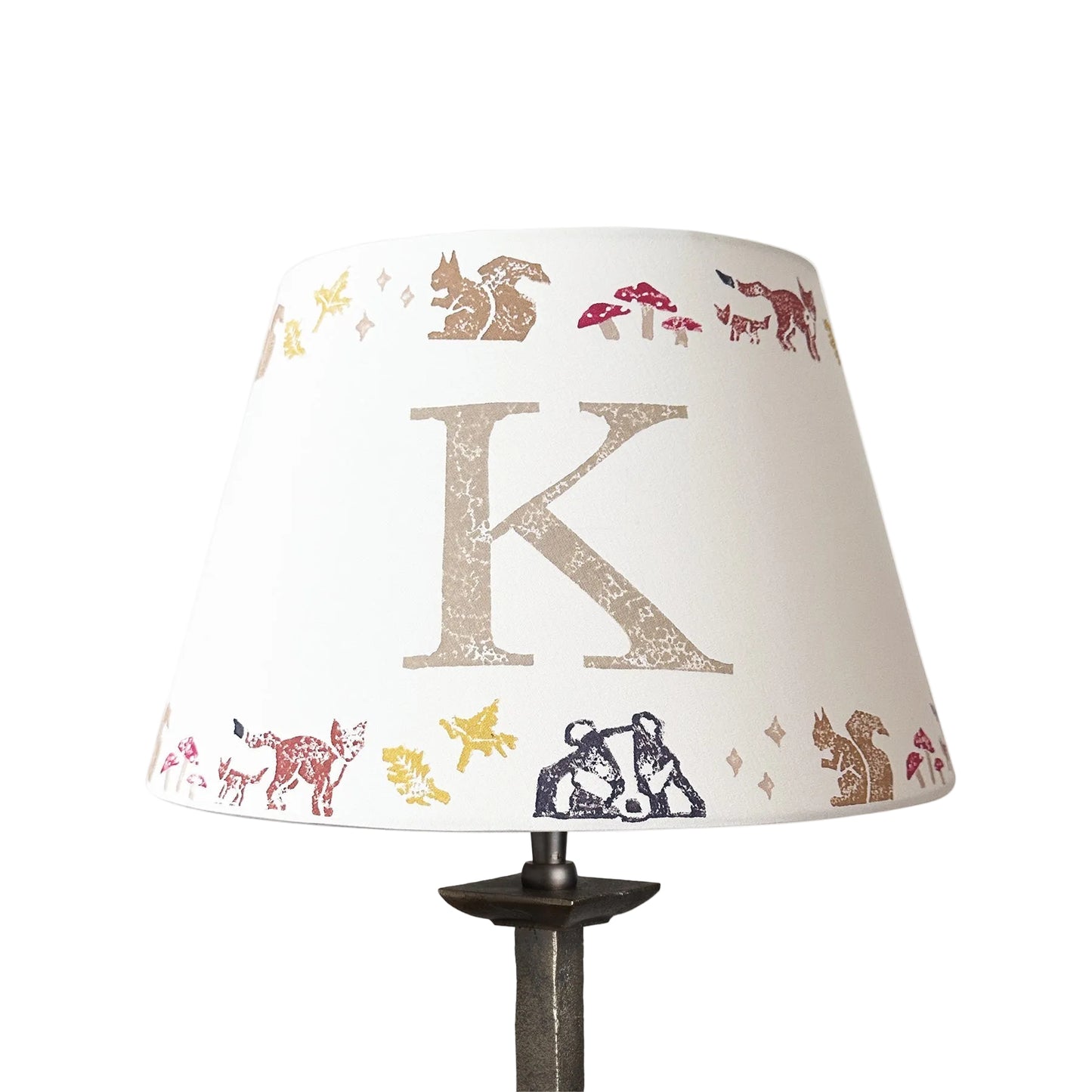 Personalised kids lampshade with woodland animals and the letter K, handmade empire lampshade in neutral tones. Empire light shade for kids bedroom design, featuring woodland animals, perfect as kids lighting or presents for new parents.