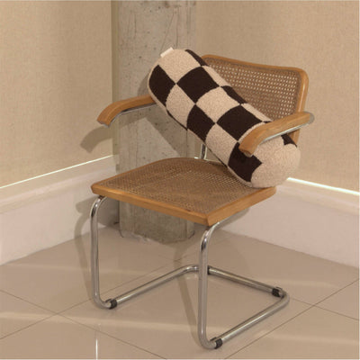 Cream and brown wool bouclé checkered bolster cushion on chair - handmade in UK