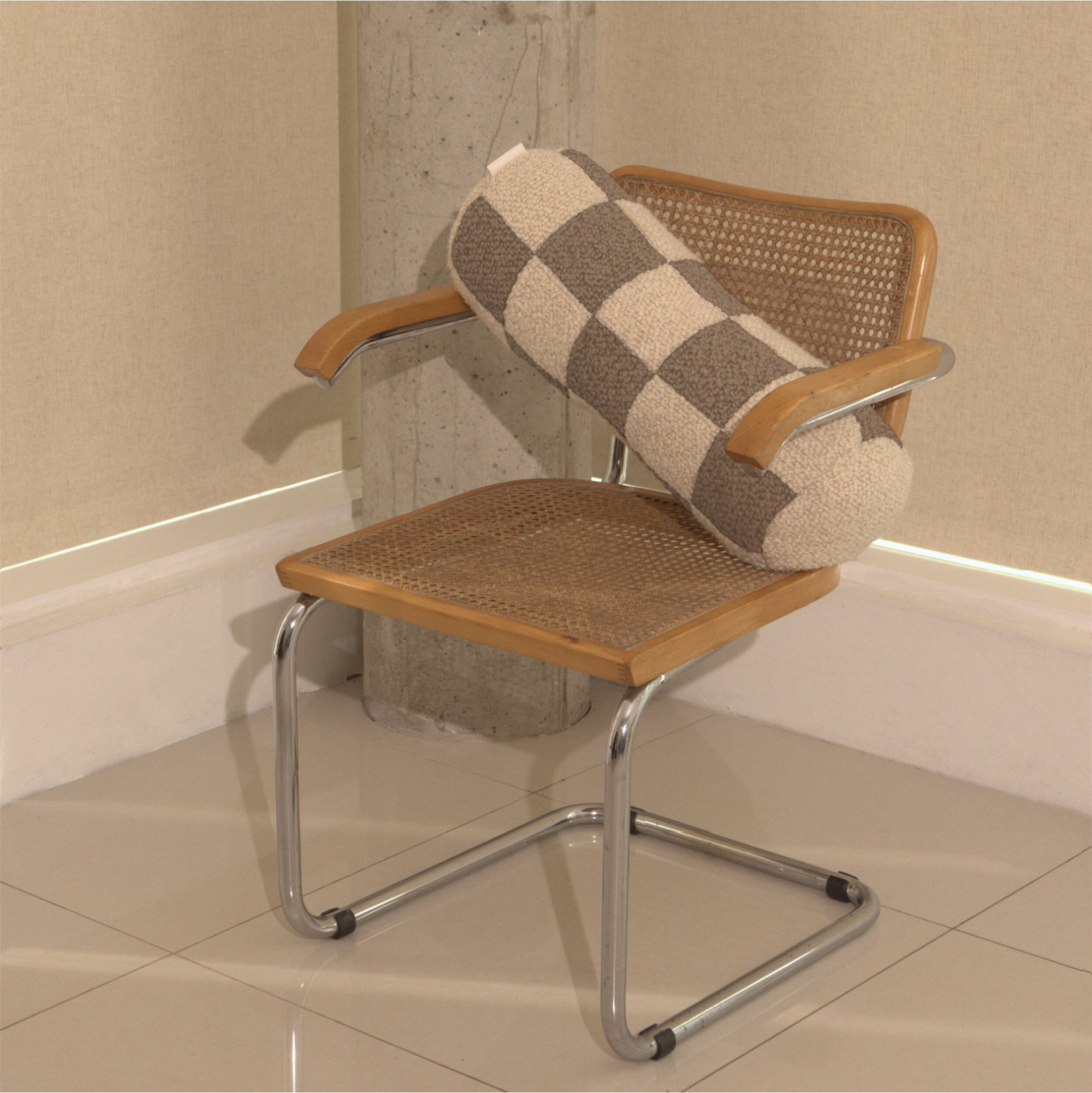 Cream and beige wool bouclé checkered bolster cushion on chair - handmade in UK