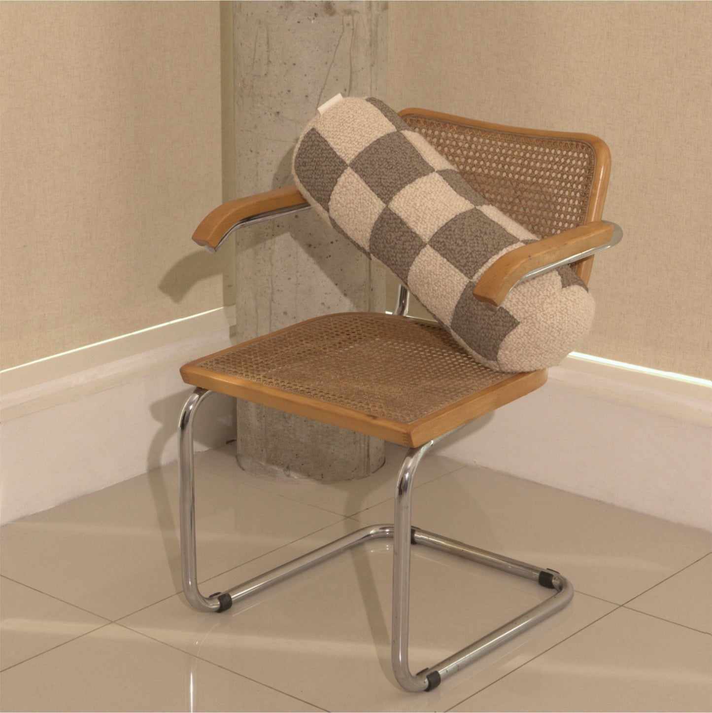 Cream and beige wool bouclé checkered bolster cushion on chair - handmade in UK
