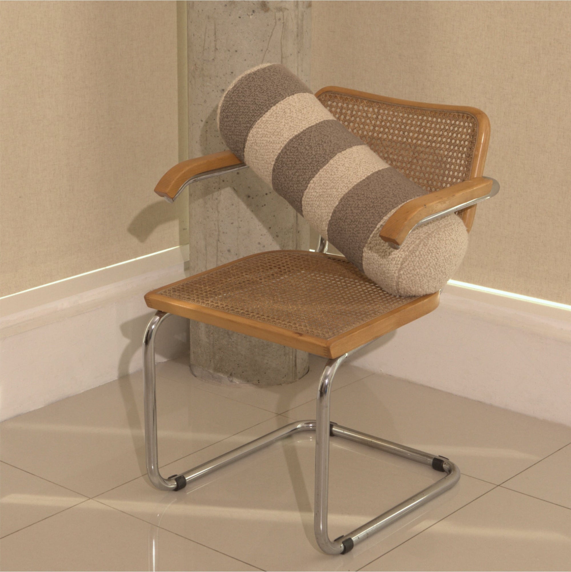 Cream and beige wool bouclé striped bolster cushion on chair - handmade in UK