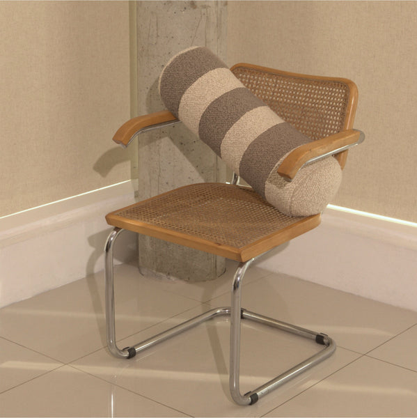 Cream and beige wool bouclé striped bolster cushion on chair - handmade in UK