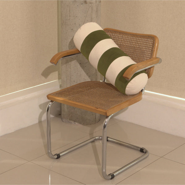 Cream and green cotton corduroy striped bolster cushion on chair - handmade in UK